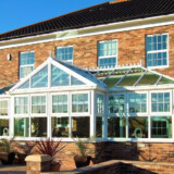 Conservatory interior showing bright, open family space